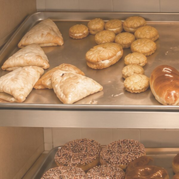 Empanadas and Mexican cookies on a bakery tray