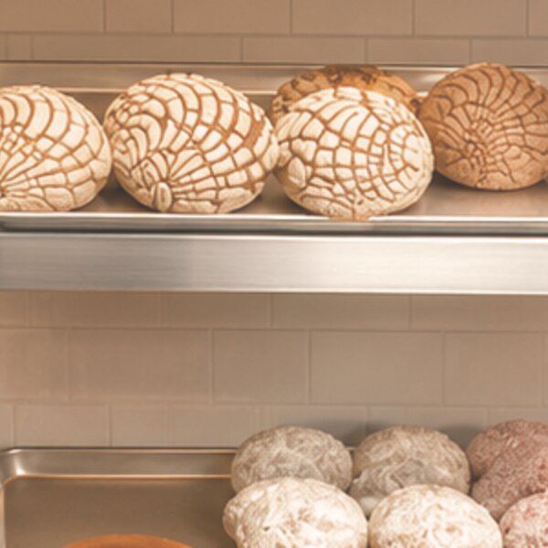 Golden conchas and powdered Mexican sweet breads